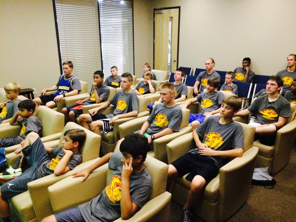 Athletes attending a classroom mentorship session