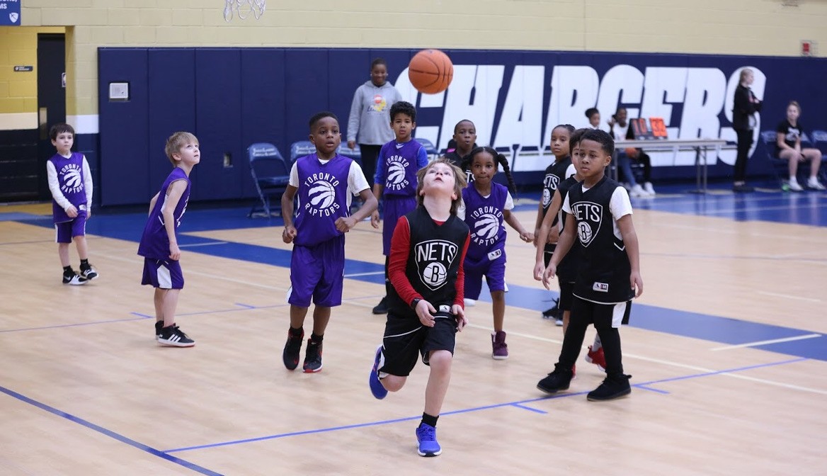 Children tracking a basketball during play